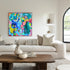 Original acrylic paitning by Yuliana Kusumastuti of bright abstract colours, shown in a living room setting