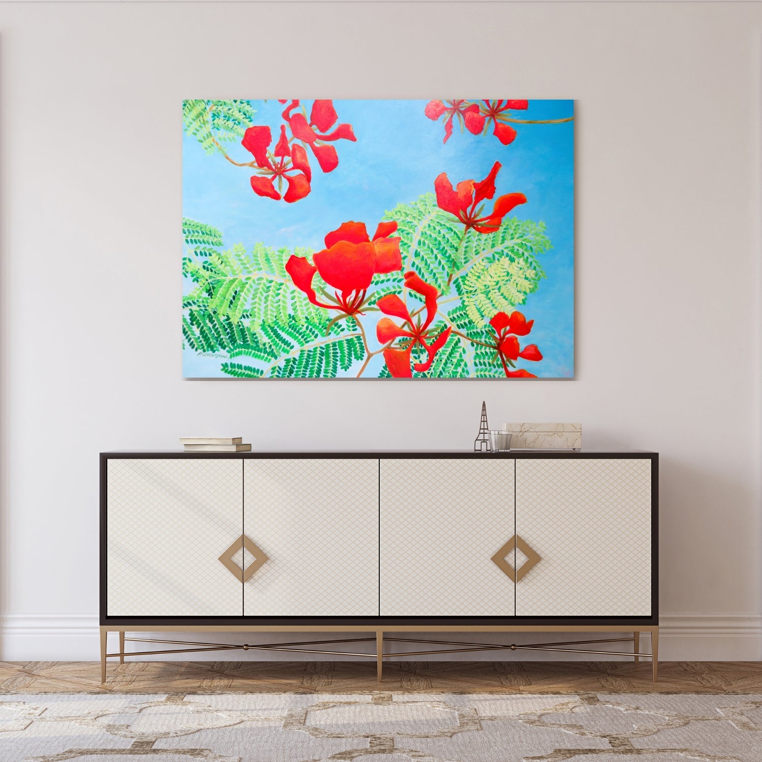 Image of an acrylic painting depicting bright red poinciana flowers and leaves against a clear blue sky, shown in an entryway setting