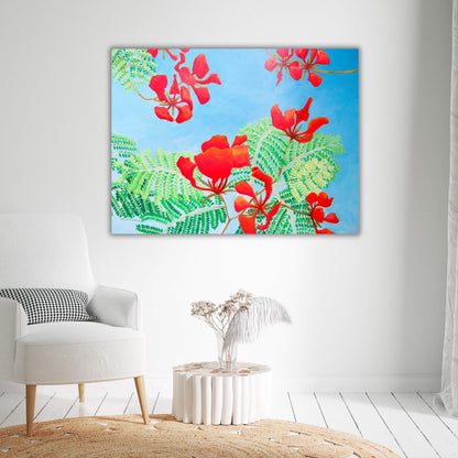 Image of an acrylic painting depicting bright red poinciana flowers and leaves against a clear blue sky, in a living room setting